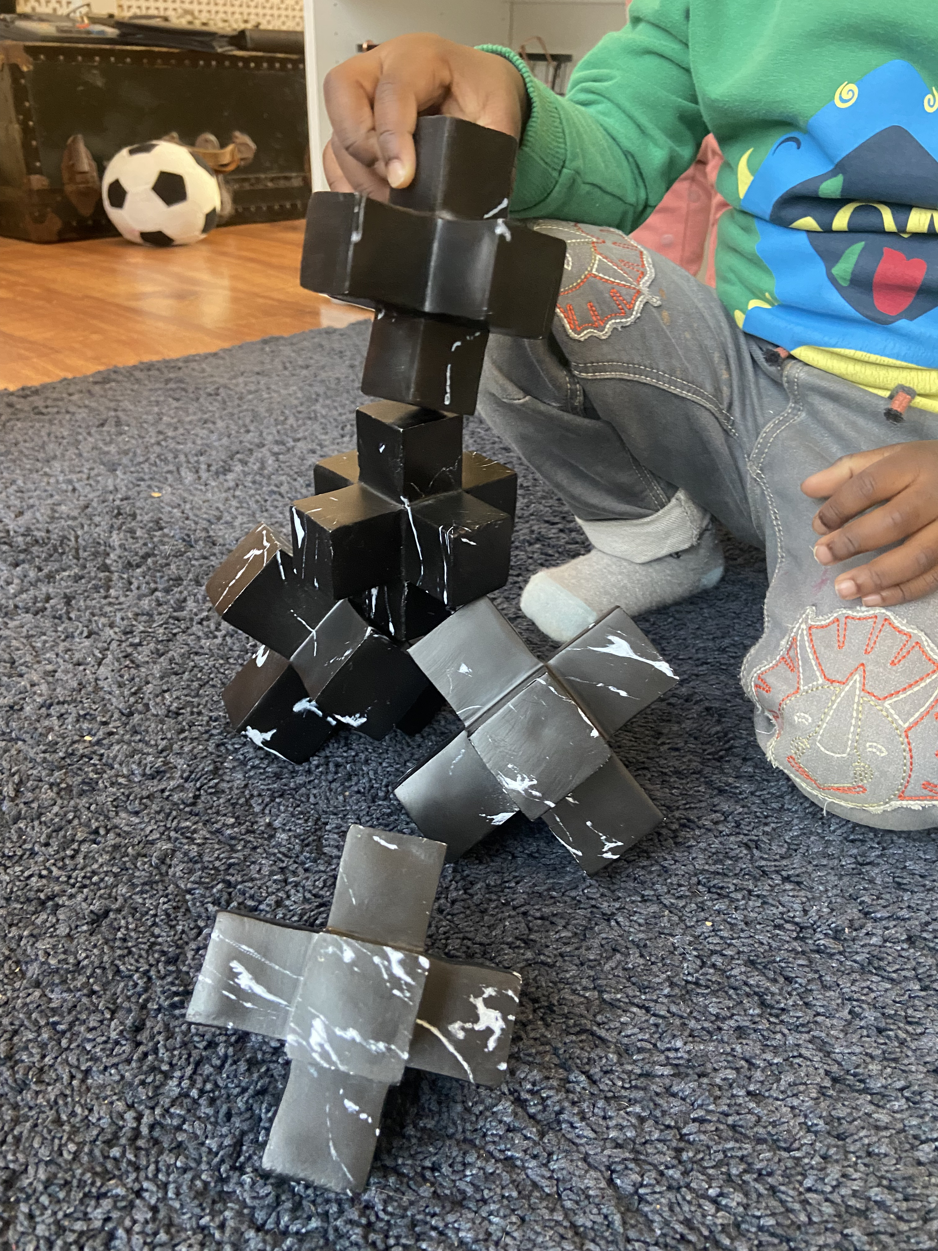 A curious child plays with a set of blocks